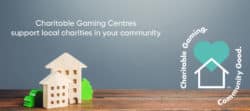 Charitable gaming, community good graphic with mini wooden houses surroiunded by bushes
