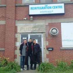 3 people standing in front of a JHS toronto reintegration centre