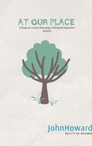 Cover of at our place report with a simple green tree with a brown trunk and branches